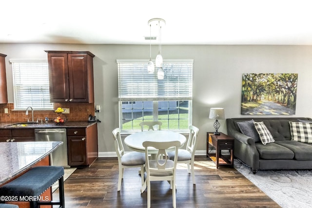 dining space with visible vents, baseboards, and dark wood finished floors