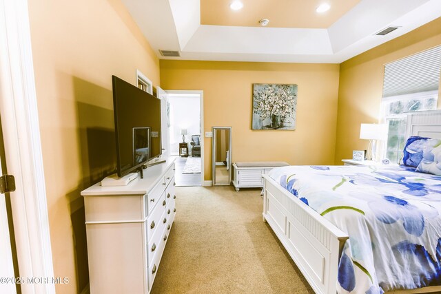 bedroom with recessed lighting, visible vents, and light carpet