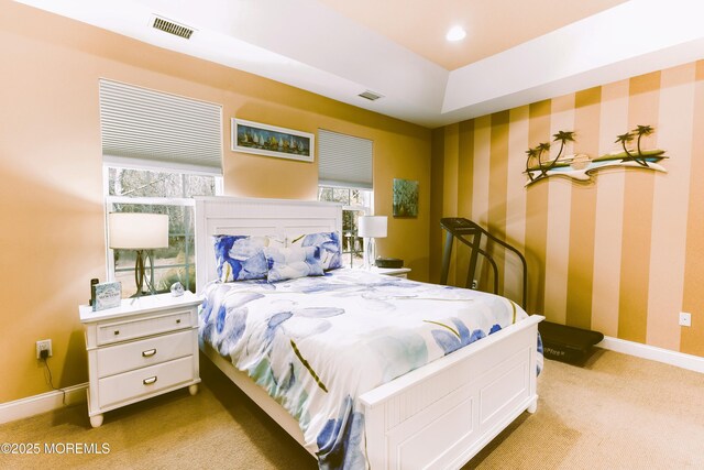 bedroom featuring visible vents, recessed lighting, wallpapered walls, baseboards, and light colored carpet