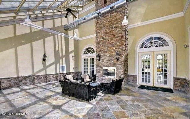 view of patio / terrace featuring ceiling fan, french doors, and an outdoor hangout area