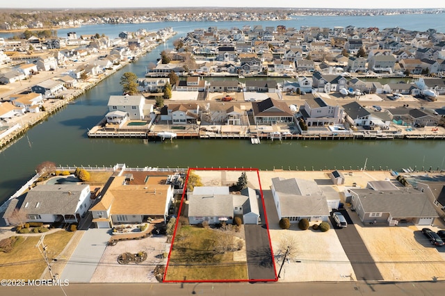 aerial view featuring a residential view and a water view