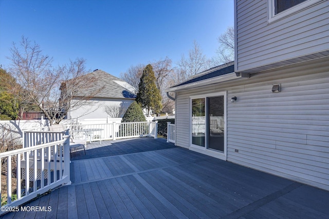 wooden terrace featuring fence