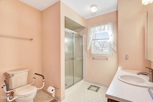 bathroom with toilet, a stall shower, tile patterned flooring, baseboards, and vanity