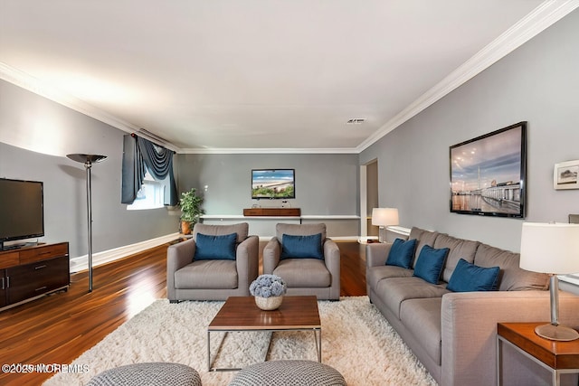 living room featuring visible vents, crown molding, baseboards, and wood finished floors