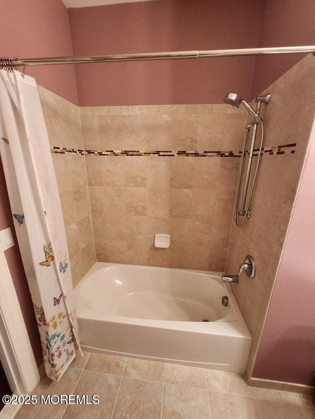 full bathroom featuring tile patterned flooring and shower / bath combo with shower curtain