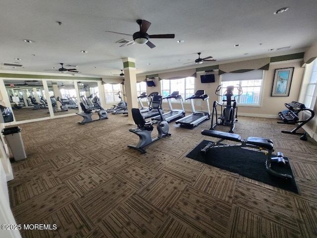 workout area with baseboards, a ceiling fan, and carpet flooring