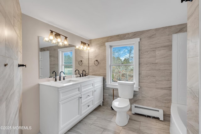 full bathroom with a sink, a baseboard radiator, toilet, and marble finish floor