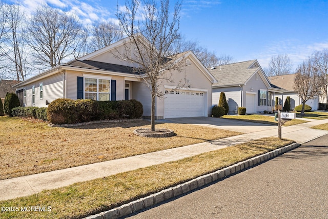 single story home with concrete driveway and an attached garage