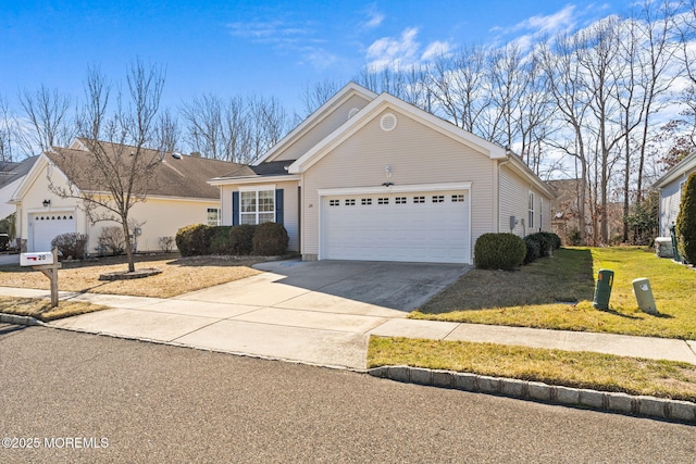 view of front of house featuring concrete driveway, an attached garage, and a front yard