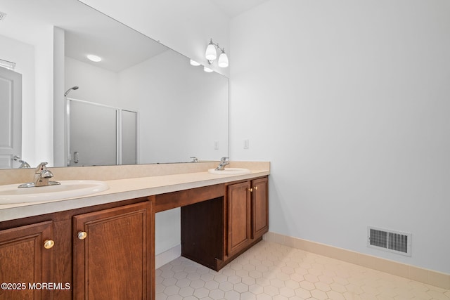 bathroom with double vanity, visible vents, a shower stall, and a sink