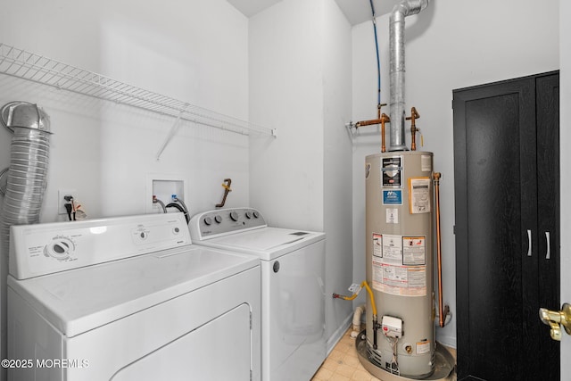 laundry room featuring gas water heater, light floors, laundry area, and washing machine and clothes dryer