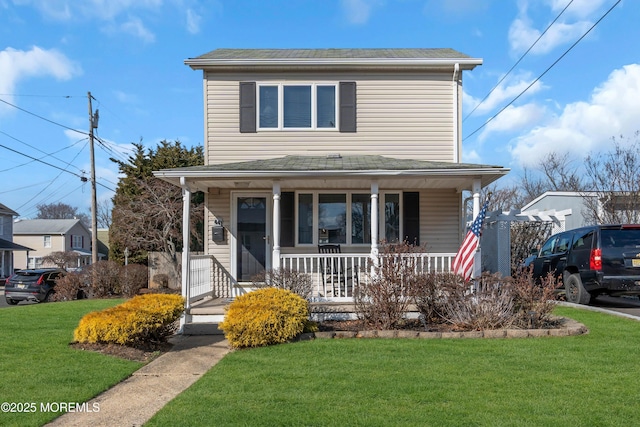 view of front of home featuring a porch and a front lawn