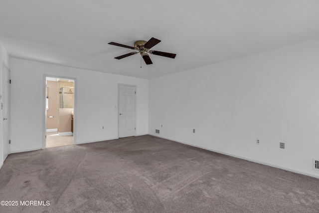 unfurnished bedroom with visible vents, carpet floors, baseboards, and ensuite bathroom