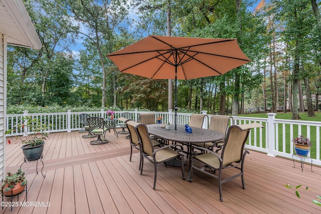 wooden terrace with outdoor dining space