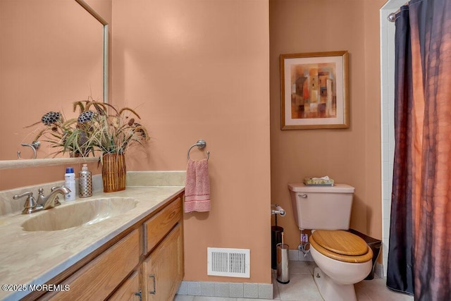 bathroom featuring visible vents, toilet, a shower with shower curtain, tile patterned floors, and vanity