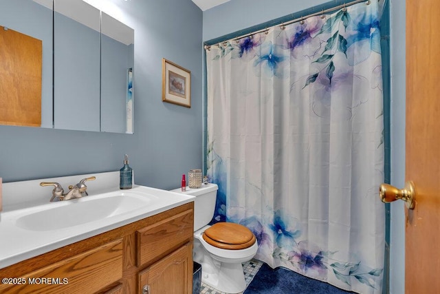 full bathroom with toilet, vanity, and a shower with curtain