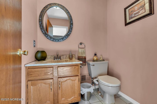 bathroom with visible vents, toilet, tile patterned flooring, baseboards, and vanity