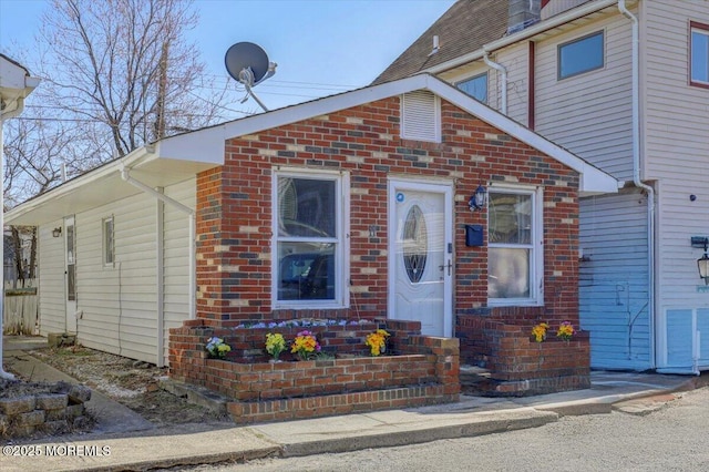 view of front of property featuring brick siding