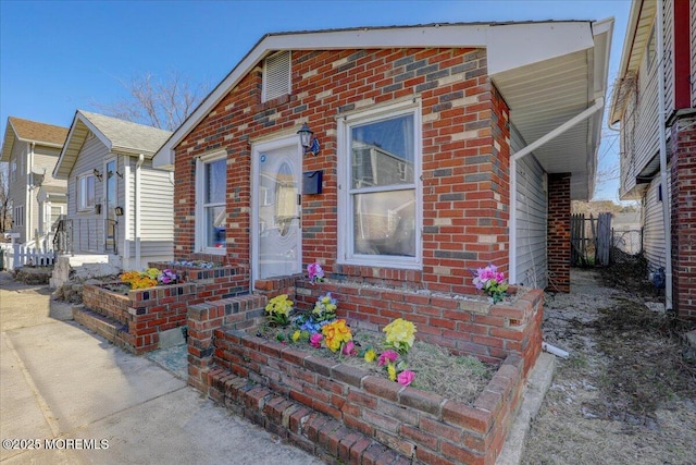 view of front of house with brick siding