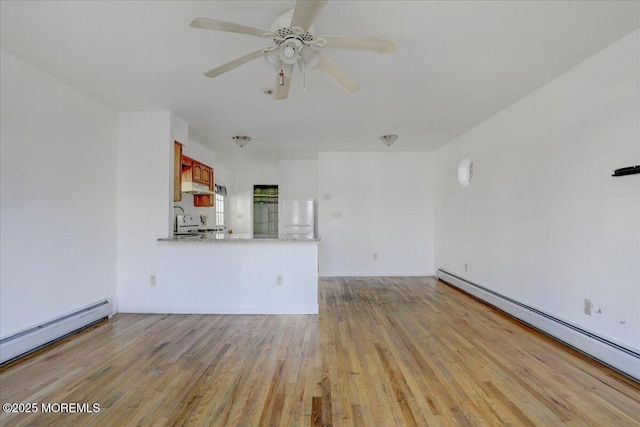 unfurnished living room with light wood finished floors, baseboard heating, a baseboard heating unit, and a ceiling fan