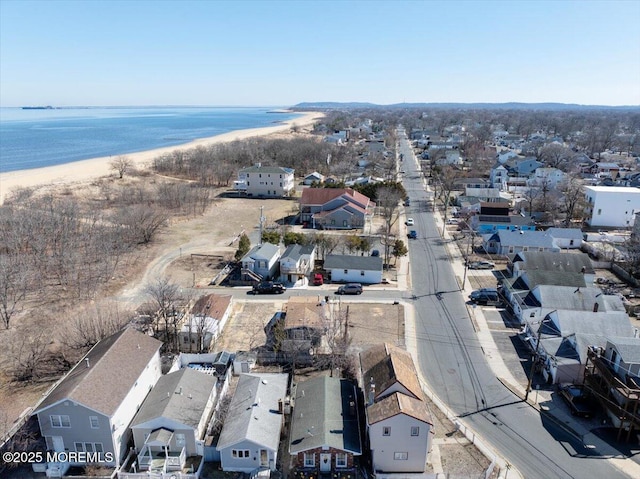 bird's eye view with a residential view, a beach view, and a water view