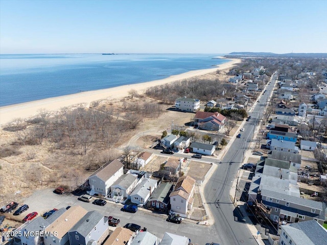 birds eye view of property featuring a residential view, a water view, and a view of the beach