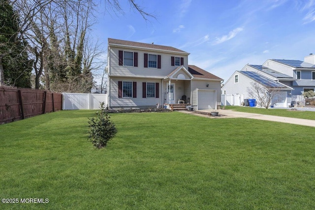 view of front facade featuring a garage, a front yard, driveway, and fence