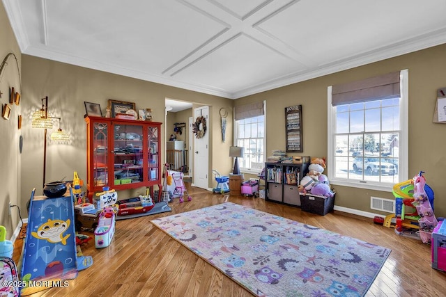 rec room featuring visible vents, coffered ceiling, wood finished floors, crown molding, and baseboards