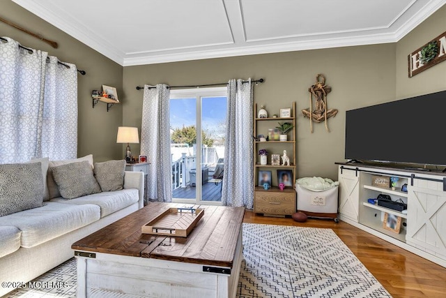 living room featuring wood finished floors and ornamental molding