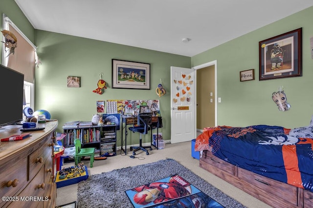 bedroom featuring baseboards and carpet floors