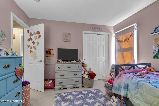 carpeted bedroom featuring a closet