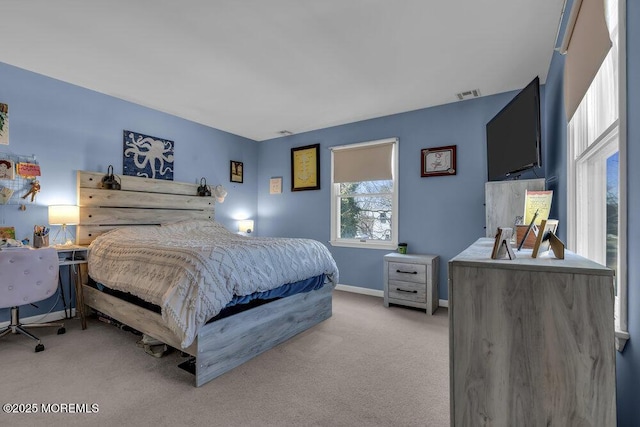 bedroom featuring visible vents, baseboards, and light colored carpet