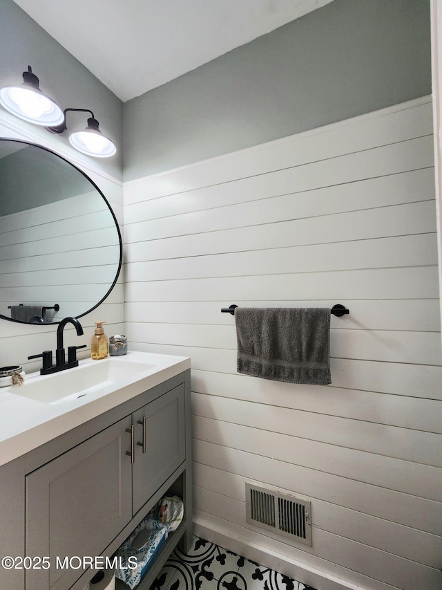 bathroom with visible vents and vanity