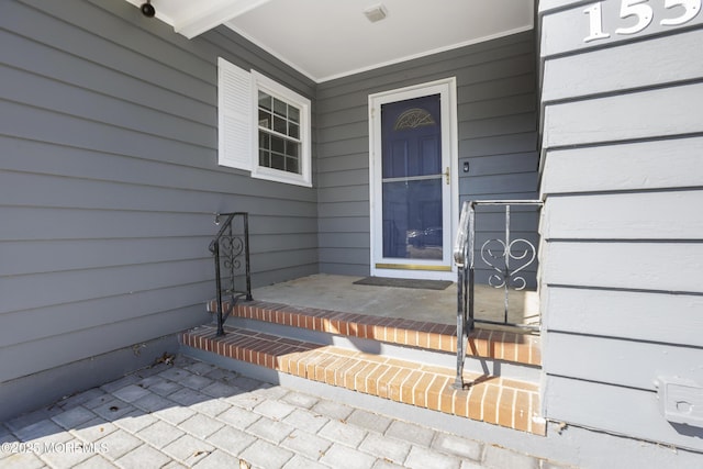 doorway to property with a porch