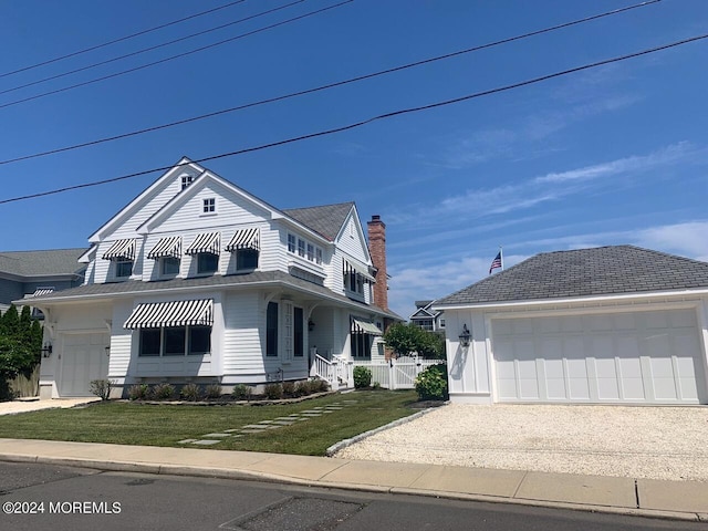 view of front facade featuring a front yard and a garage