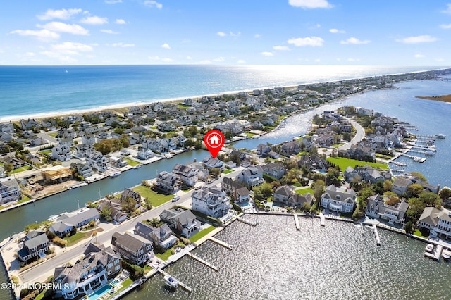 bird's eye view featuring a residential view and a water view