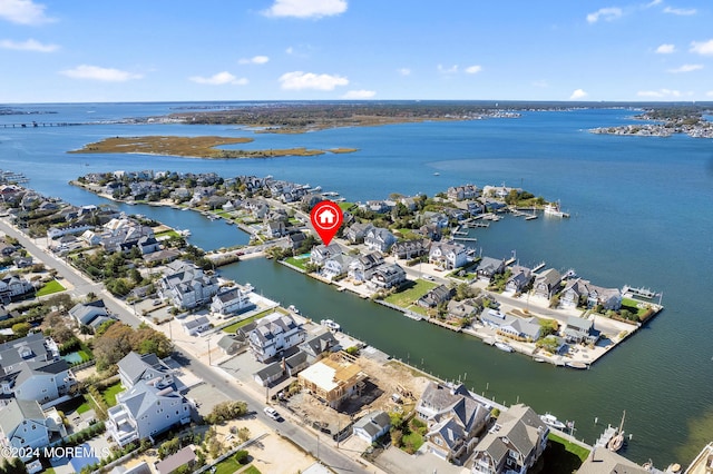 aerial view featuring a residential view and a water view