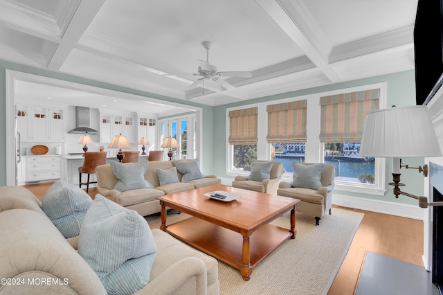 living room featuring beam ceiling, coffered ceiling, and light wood finished floors