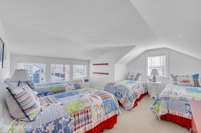 carpeted bedroom featuring lofted ceiling and baseboards