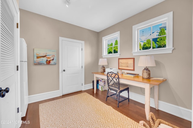 home office featuring dark wood finished floors and baseboards