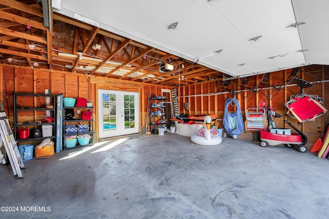 garage featuring french doors and a garage door opener