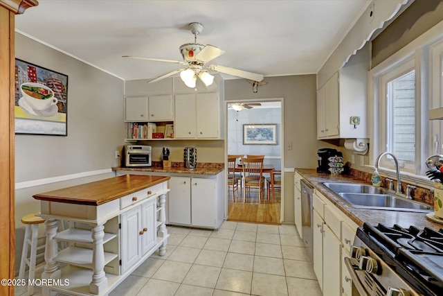 kitchen featuring ornamental molding, open shelves, a sink, white cabinetry, and light tile patterned flooring