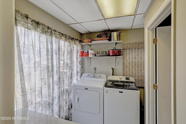 washroom featuring laundry area and separate washer and dryer