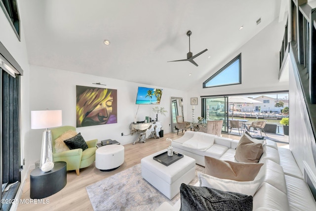 living area featuring recessed lighting, high vaulted ceiling, wood finished floors, and a ceiling fan