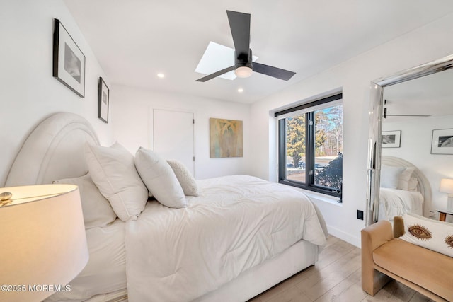 bedroom featuring recessed lighting, baseboards, light wood-type flooring, and a ceiling fan