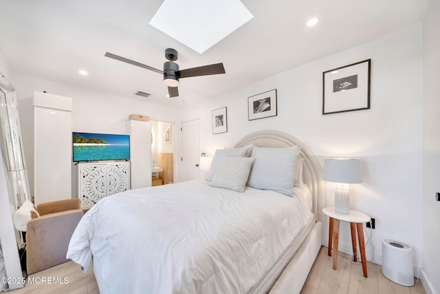 bedroom with light wood-type flooring, visible vents, a skylight, and recessed lighting