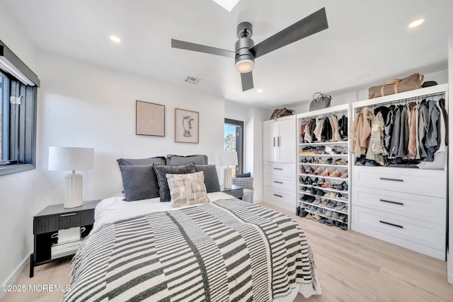 bedroom with recessed lighting, visible vents, light wood-style floors, and a ceiling fan