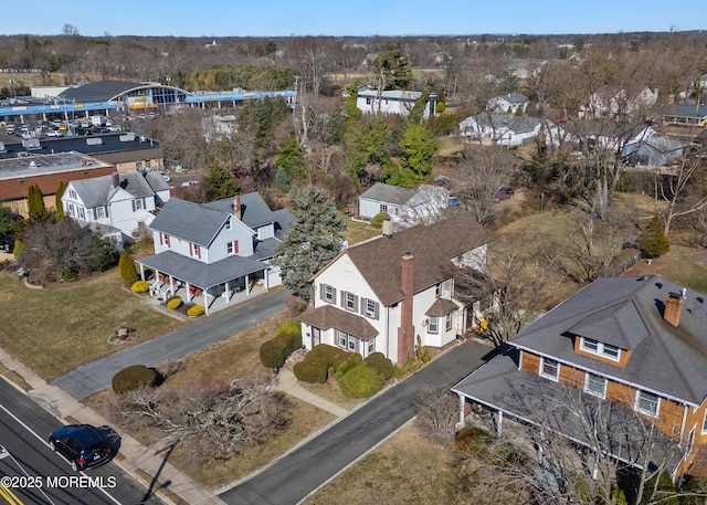 birds eye view of property with a residential view