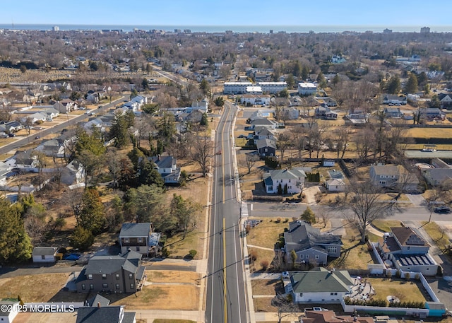 birds eye view of property with a residential view