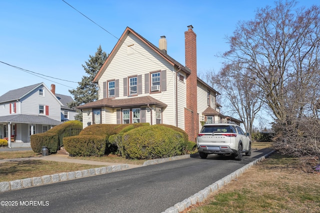 view of front of property with a chimney